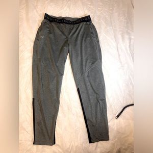 Gray and black under armour athletic pants